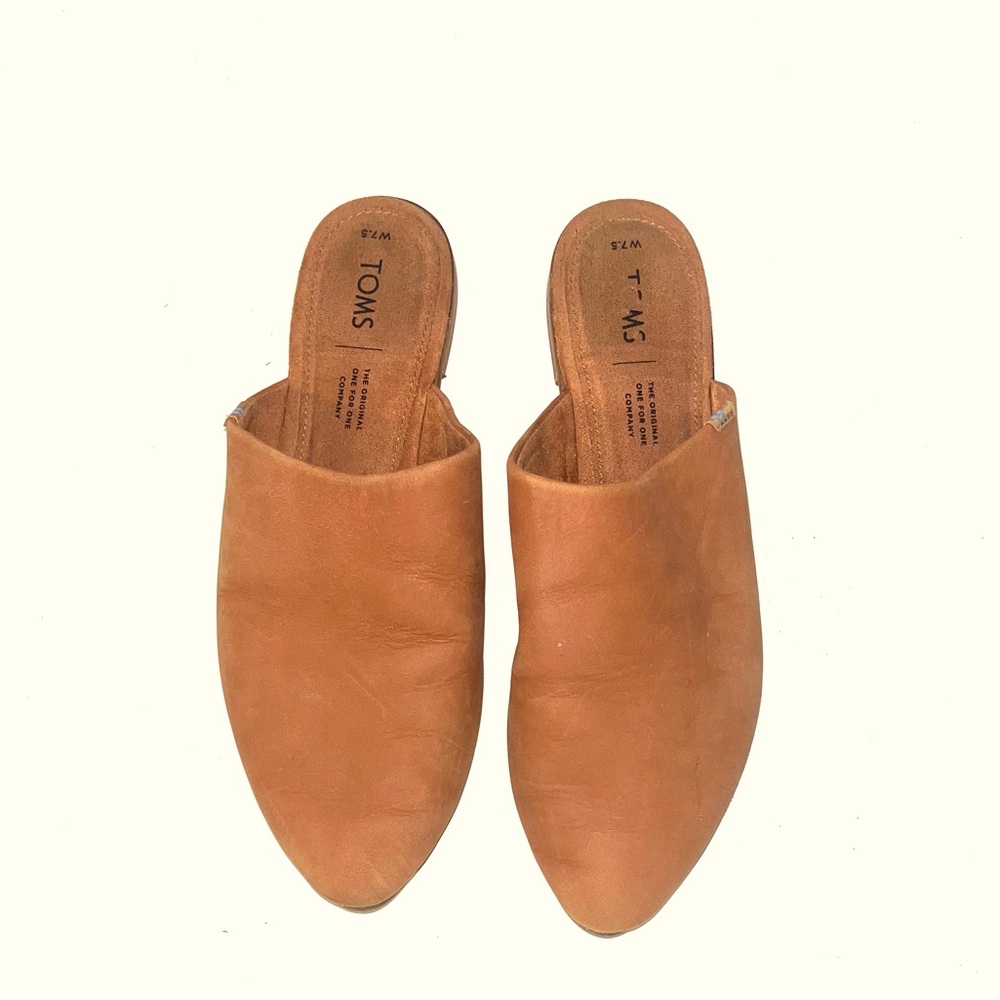 Tom’s leather slip ons